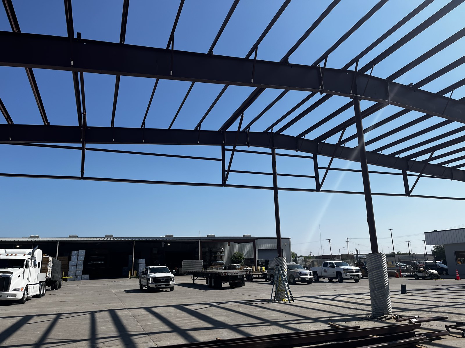 Industrial steel building frame and work yard in North Texas